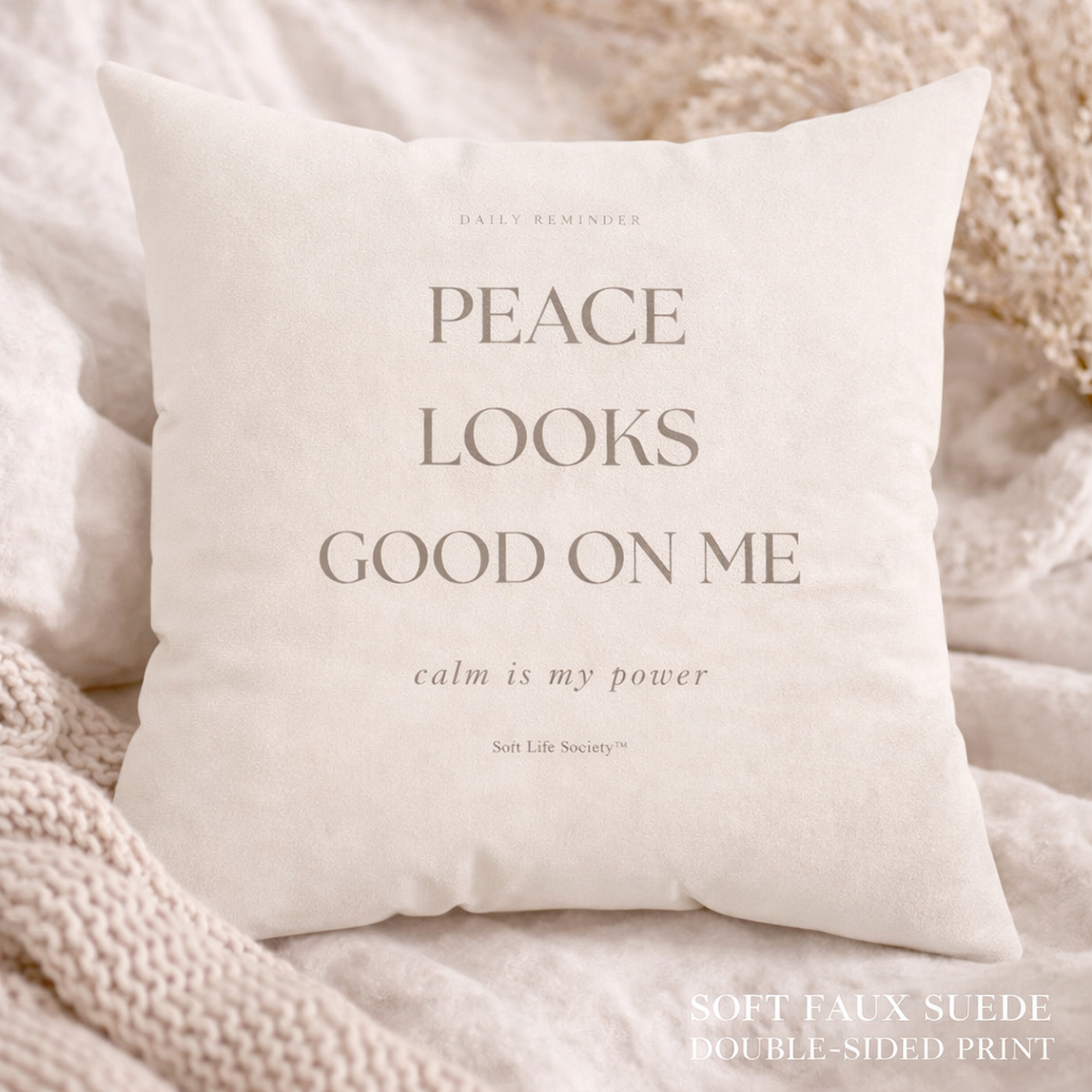 White pillow with text on a soft beige background