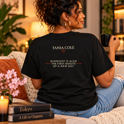 Woman wearing back of Tokyo After Midnight reader tee featuring Tania Cole and midnight quote