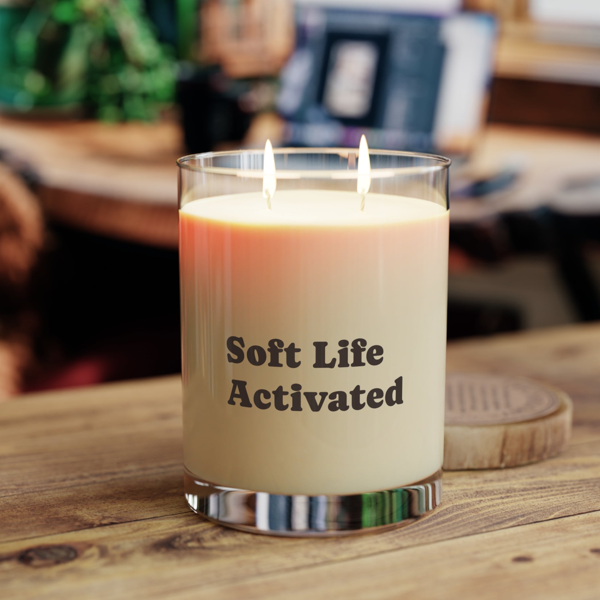 Soft Life Society Affirmation Candle with 'Soft Life Activated' text on a wooden surface