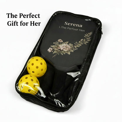 Black carrying case with yellow balls and floral design on a white background