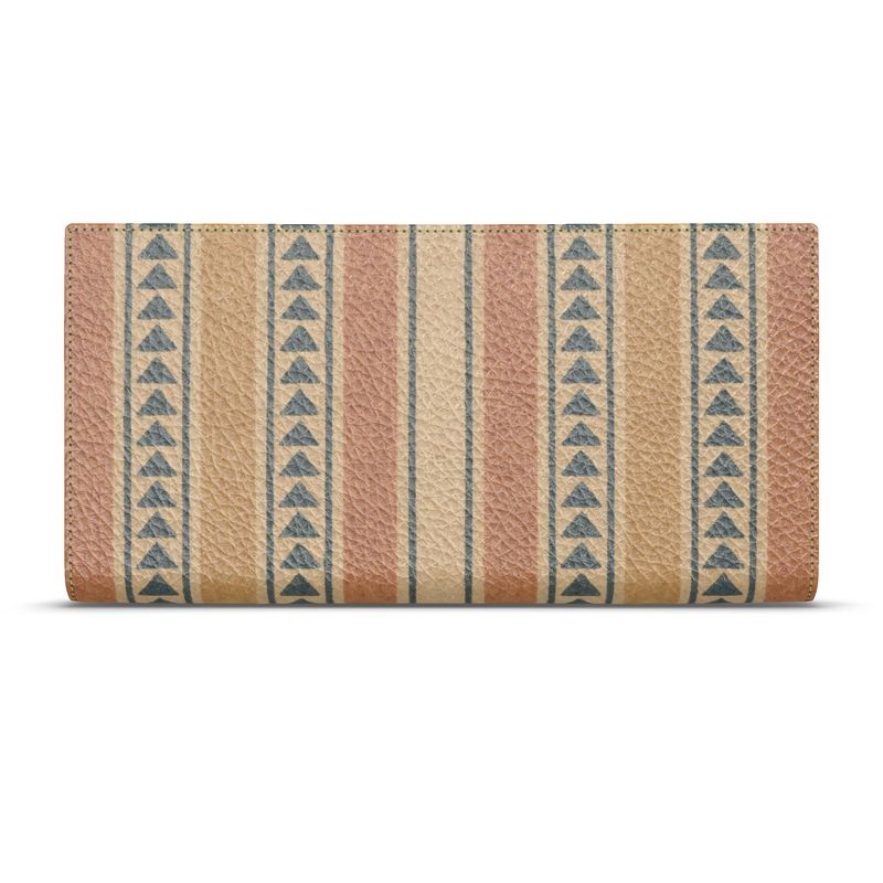 Amara Heritage Microprint™ Travel Wallet shown closed, featuring warm geometric stripes printed on pebbled leather.