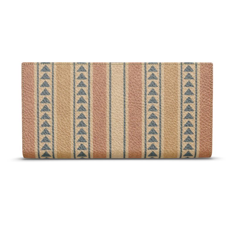 Amara Heritage Microprint™ Travel Wallet shown closed, featuring warm geometric stripes printed on pebbled leather.
