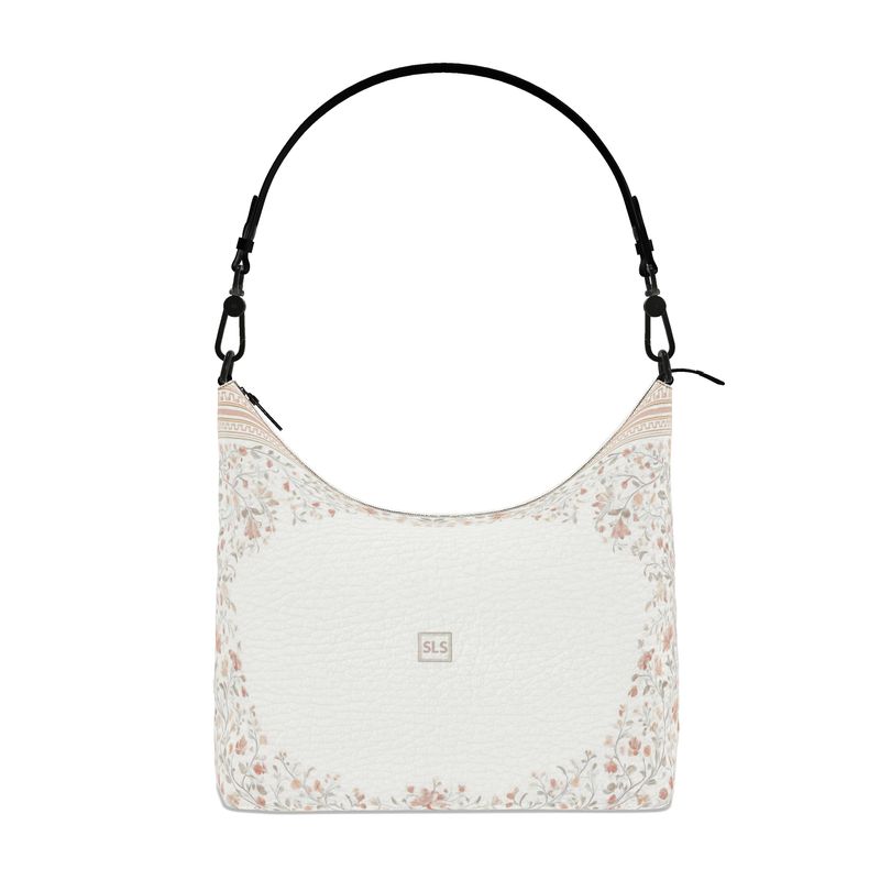 Floral-patterned shoulder bag with a white background