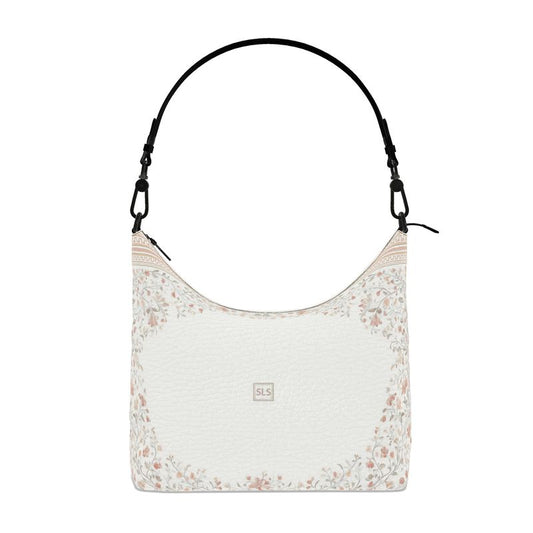 Floral-patterned shoulder bag with a white background