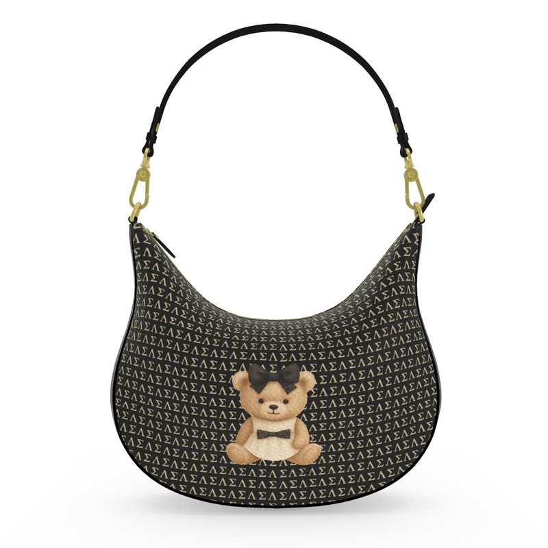 A black monogram curve hobo bag featuring a couture teddy patch with a signature bow, gold hardware, and a designer-inspired silhouette.