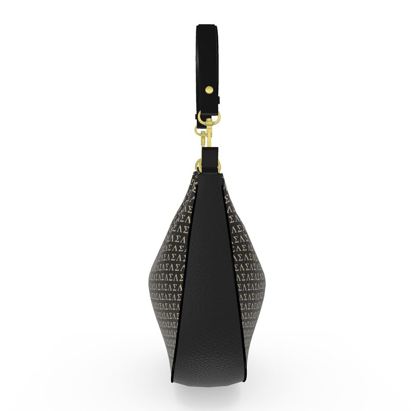 Side view of a black monogram curve hobo bag featuring a couture teddy patch with a signature bow, gold hardware, and a designer-inspired silhouette.