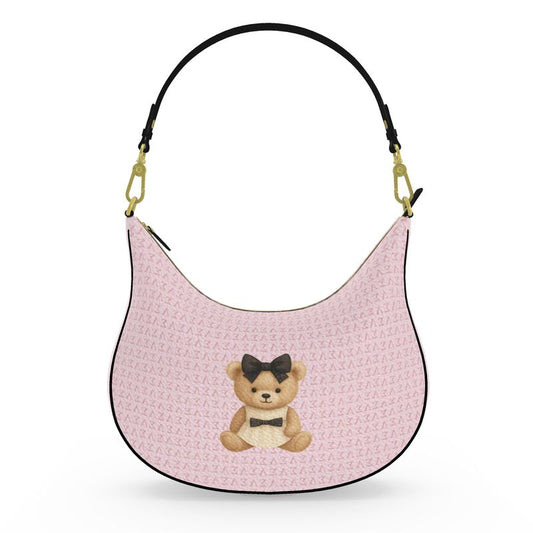 Front view of the Le Petit Teddy™ Curve Hobo in Blush Couture Monogram, full-grain Nappa leather with teddy emblem.