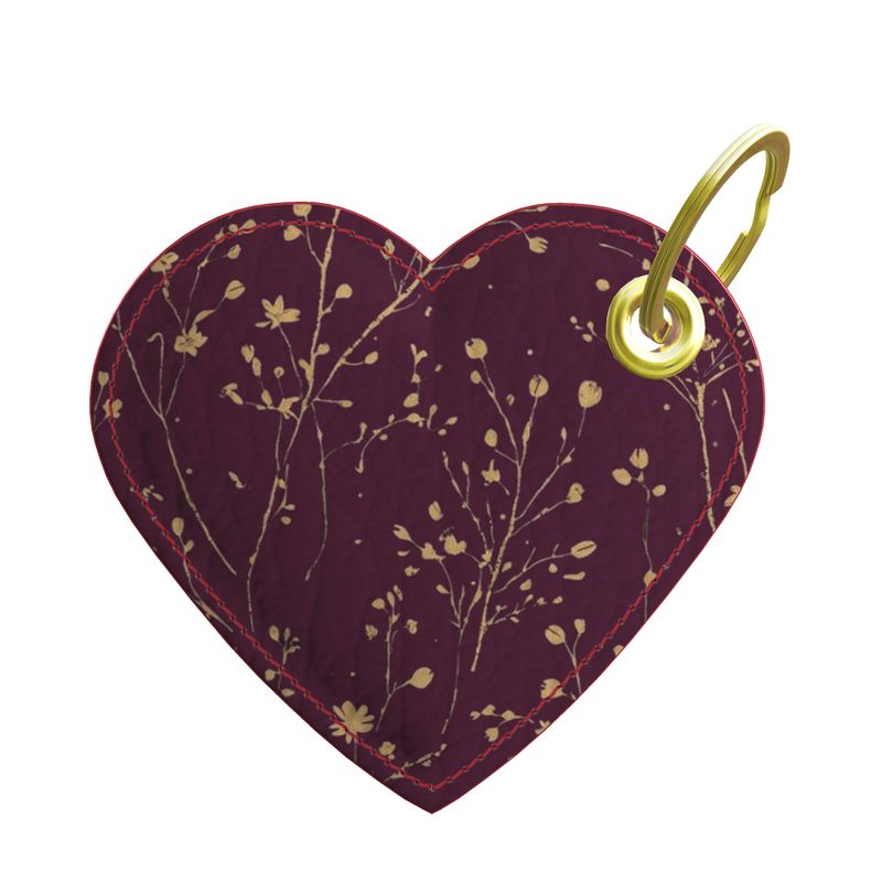 Heart-shaped keychain with floral pattern on a white background