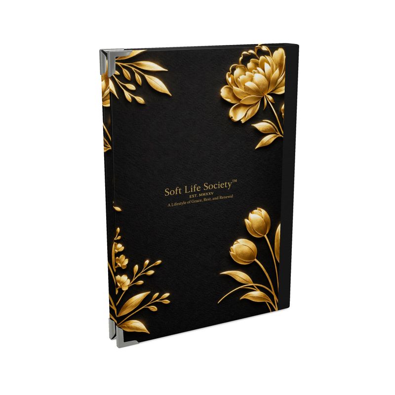 Black book with gold floral designs and 'Soft Life Society' branding on a white background