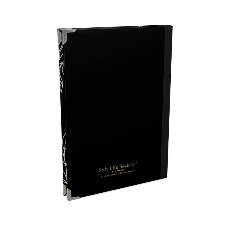 Black notebook with 'Soft Life Society' branding on a white background