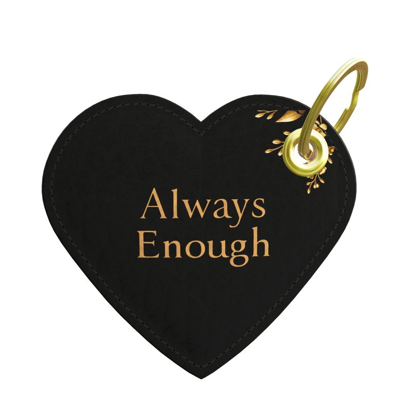 Black heart-shaped keychain with 'Always Enough' text and gold accents on a white background