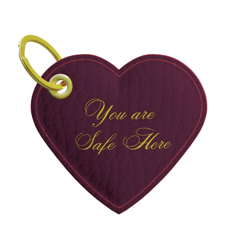 Heart-shaped keychain with 'You are Safe Here' text on a white background