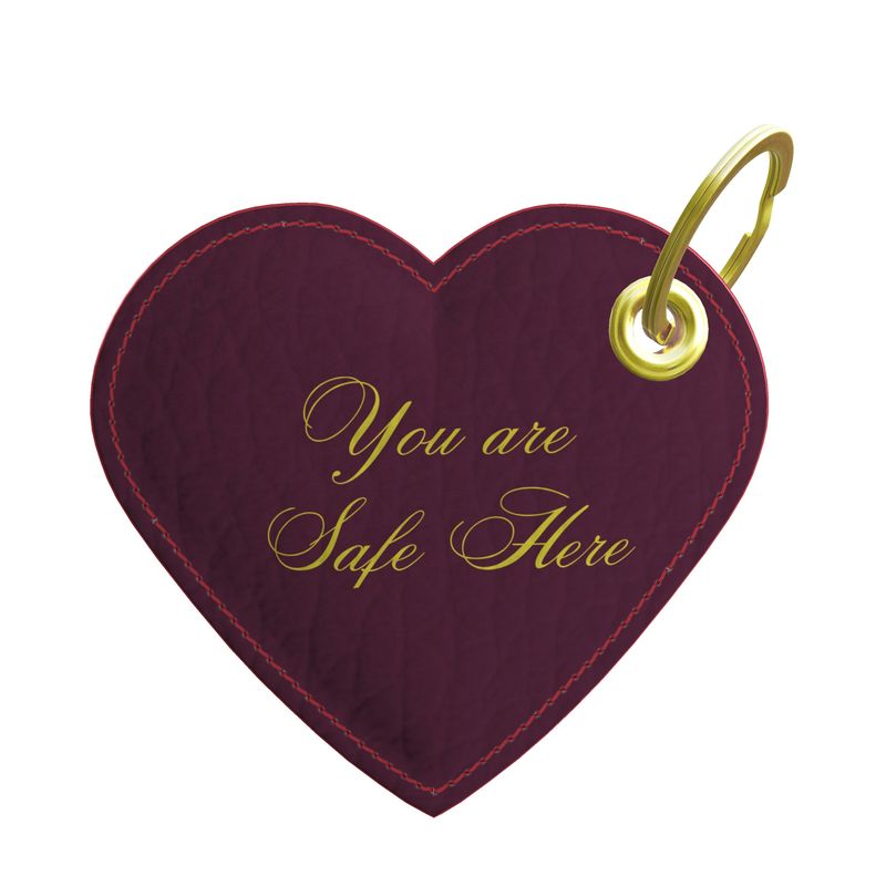 Heart-shaped keychain with 'You are Safe Here' text on a white background