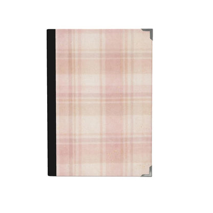 Plaid patterned journal on a white background