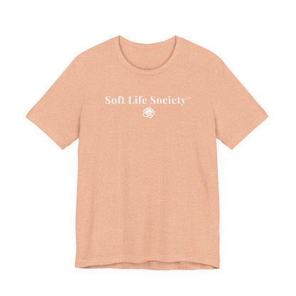 Soft Life Society peach t-shirt with white lettering and rose emblem, casual soft life tee
