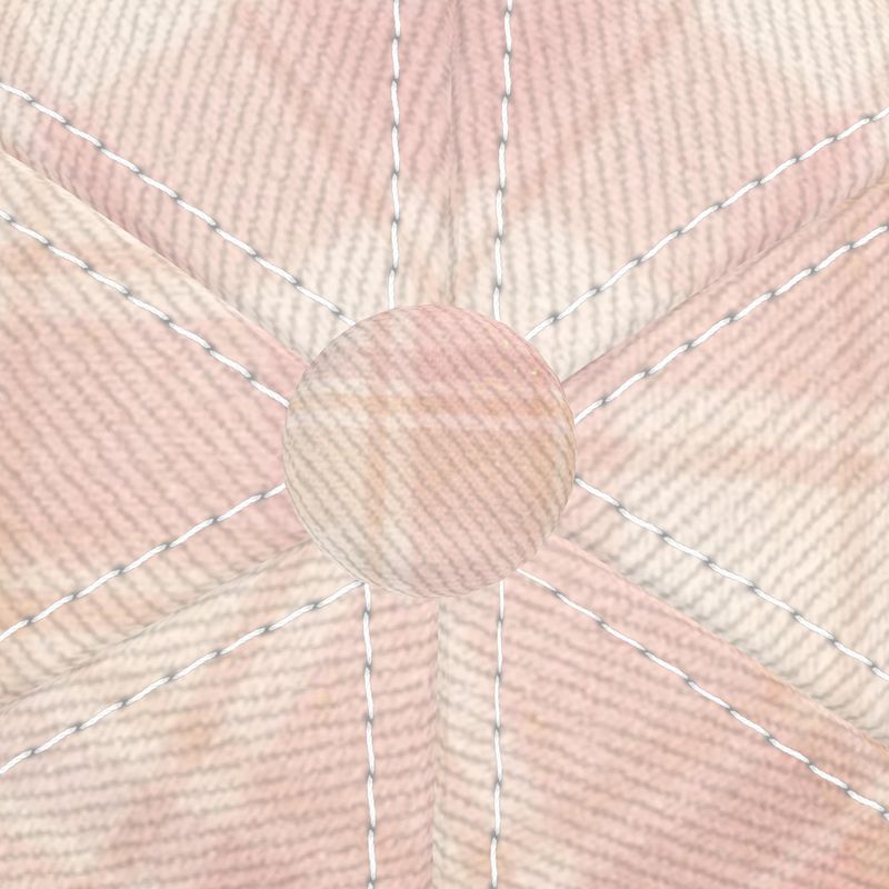 Close-up of a pink fabric with a bow and stitching details