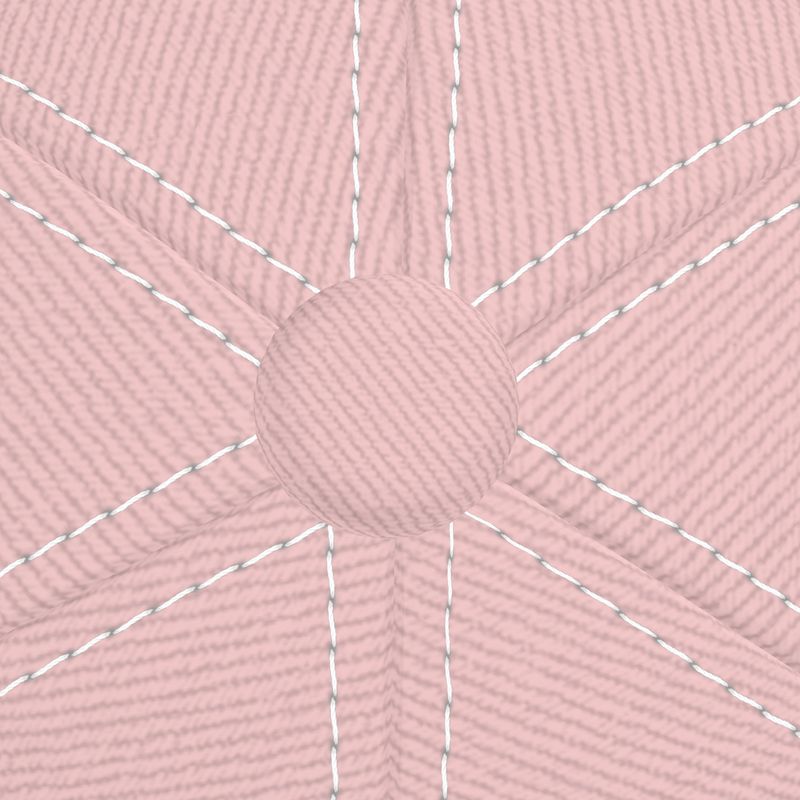Close-up of top stitching and button detail on blush pink six-panel baseball cap