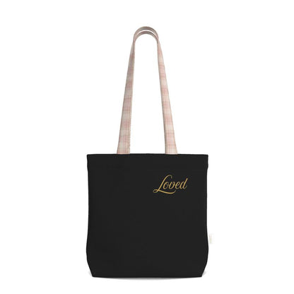 Black tote bag with 'Loved' embroidery on a white background