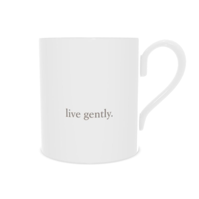 White mug with 'live gently.' text on a white background