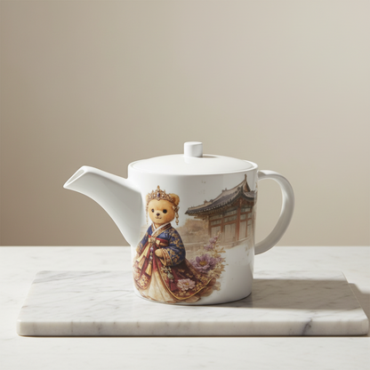 Teapot with a teddy bear design on a marble surface