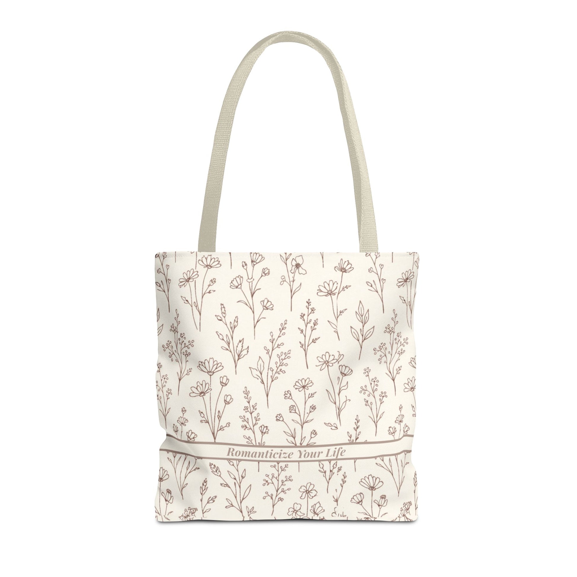 Tote bag with floral pattern and text on a white background