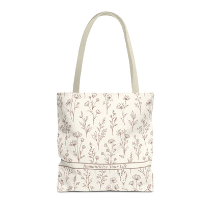 Tote bag with floral pattern and text on a white background