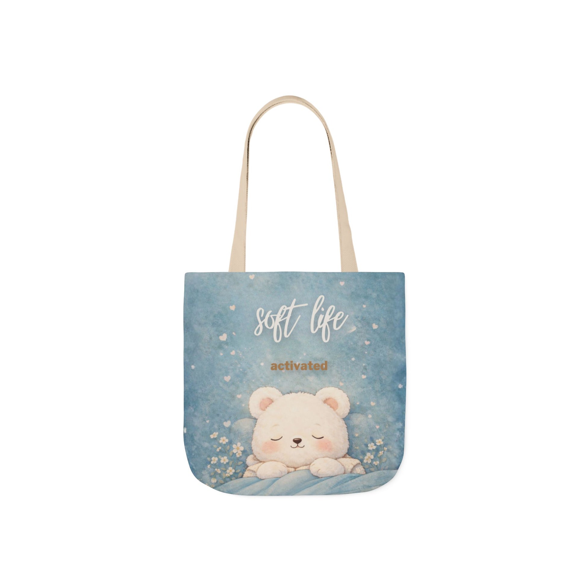 Tote bag with a cute bear design and 'soft life activated' text on a blue background