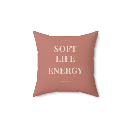 Pink pillow with 'SOFT LIFE ENERGY' text on a white background
