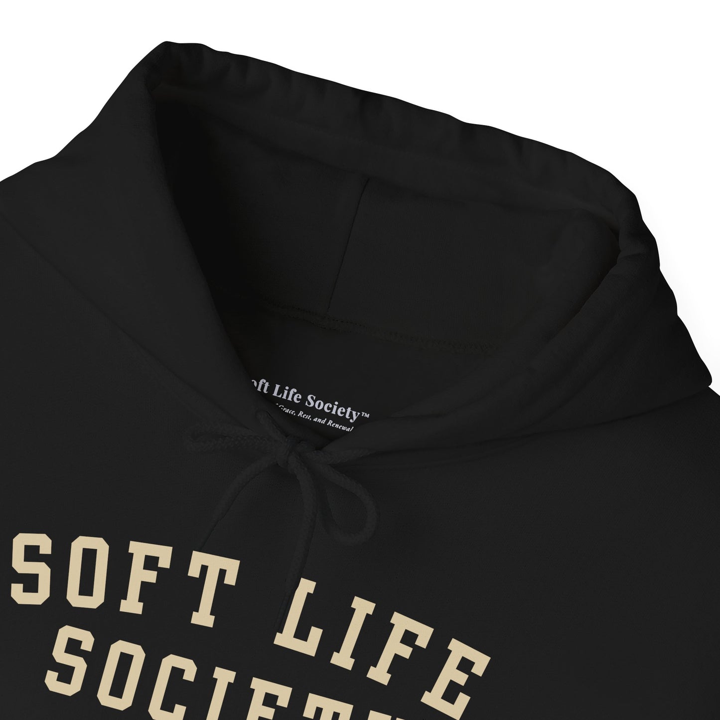 Close-up of the hood and neckline of a black Soft Life Society pullover hoodie showing soft fabric texture.