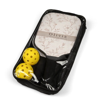 Black pickleball paddle case with two yellow pickleballs and floral-patterned paddles on a white background.