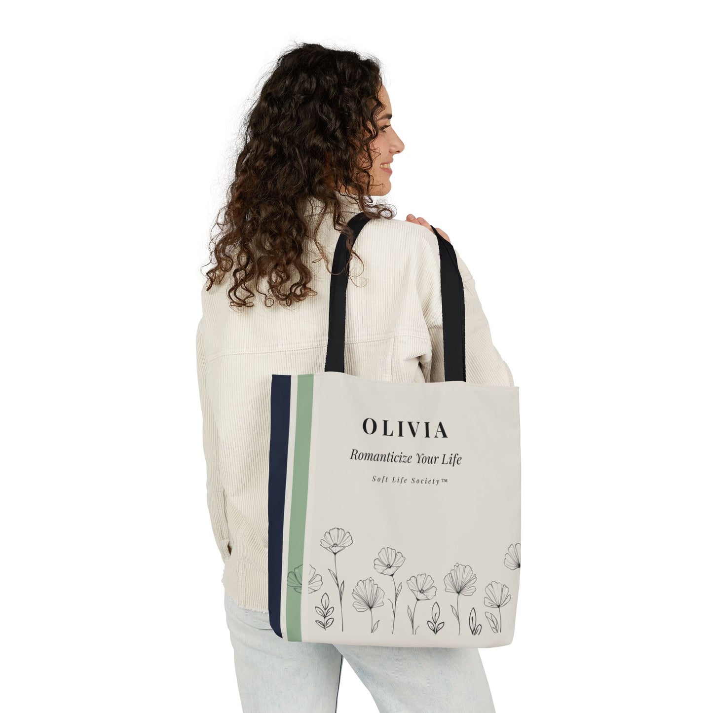 Woman carrying a tote bag with floral design and text on a white background