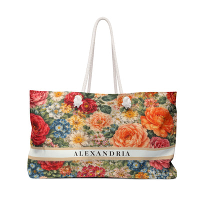 Floral patterned bag with 'Alexandria' branding on a white background