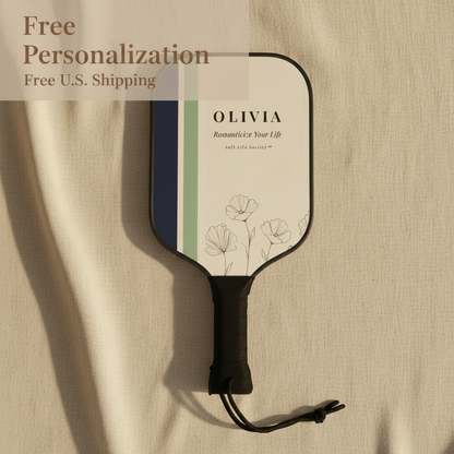 Paddle with 'OLIVIA' personalized on a beige background
