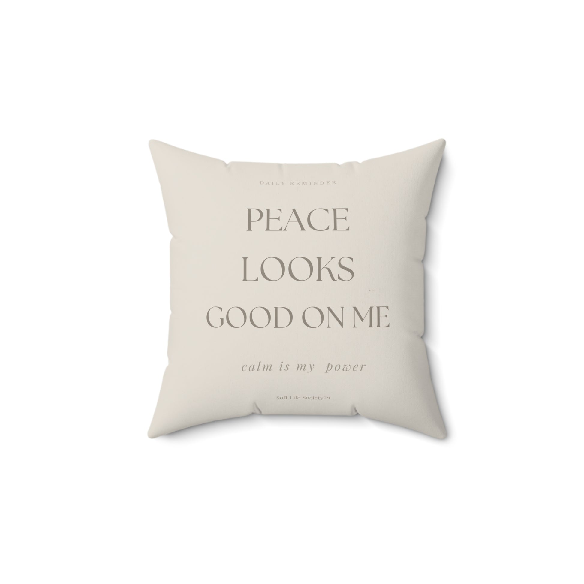 Beige pillow with text on a white background