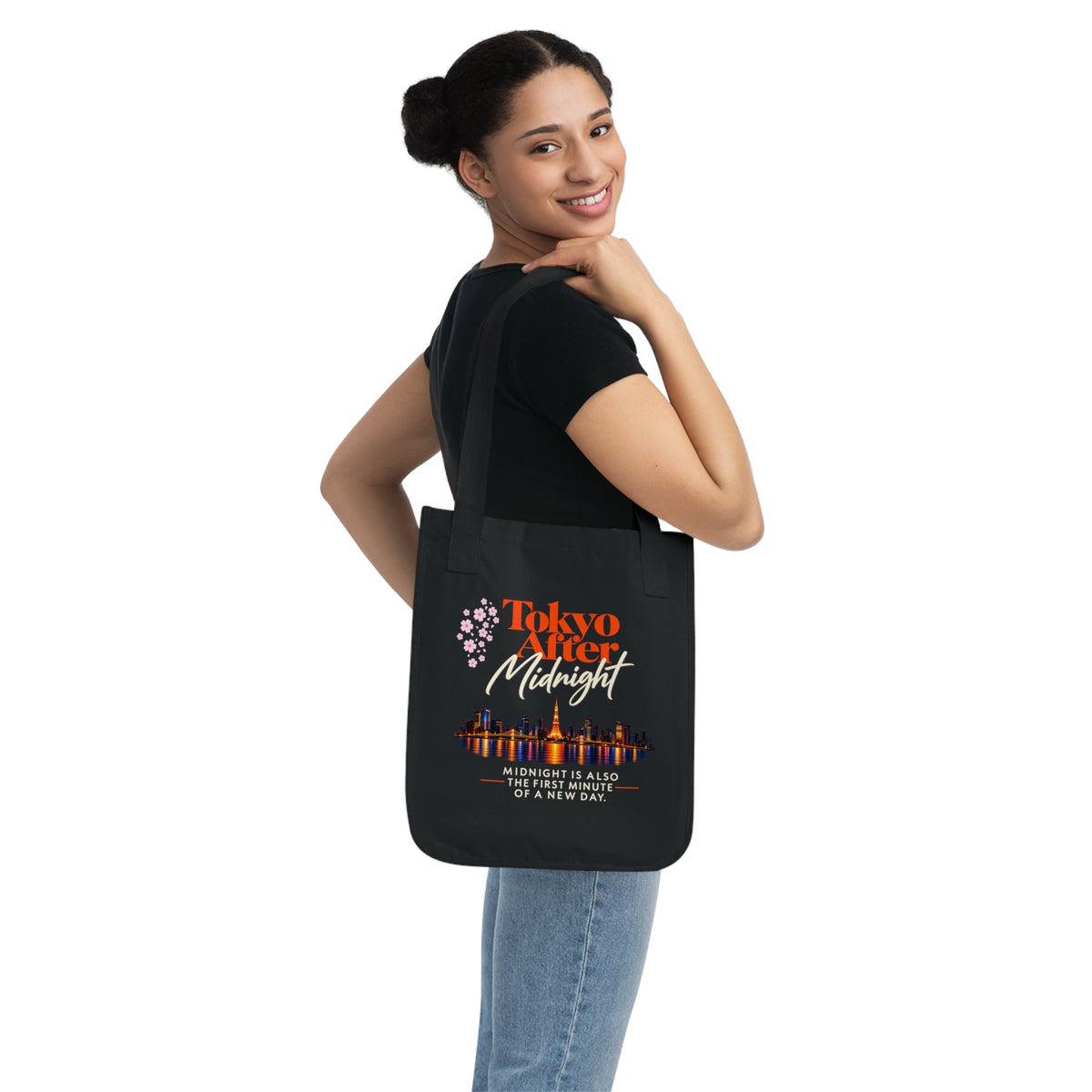 Black Tokyo After Midnight organic cotton tote bag worn over the shoulder to show the bag’s size and fit.