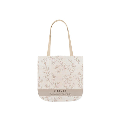Tote bag with floral pattern and 'Olivia' branding on a white background