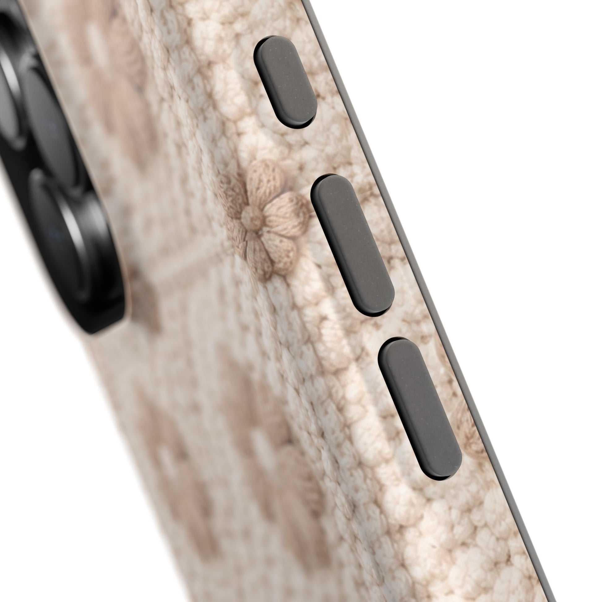 Close-up of a phone case with wood grain texture and three black buttons on a white background