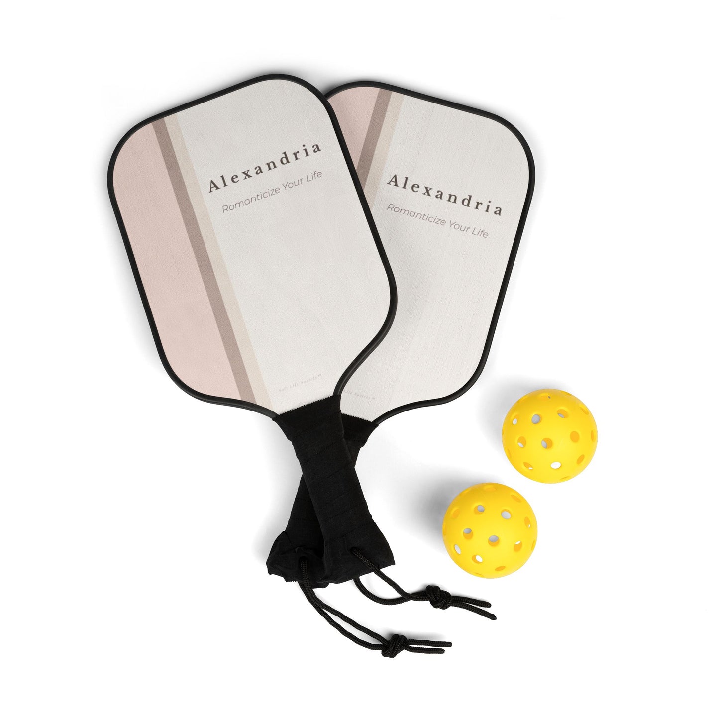 Two pickleball paddles with 'Alexandria' branding and three yellow pickleballs on a white background.