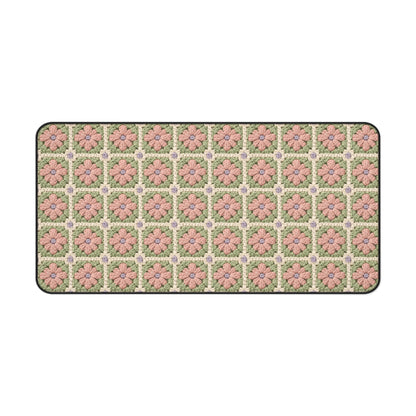 Floral patterned rug with pink flowers on a green background