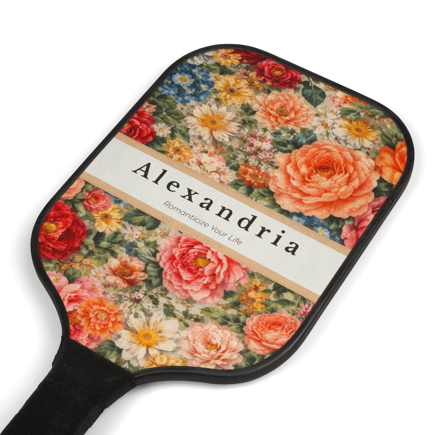 Floral-patterned paddle with 'Alexandria' branding on a white background