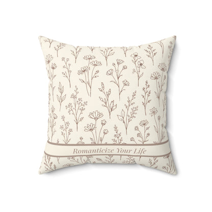 Decorative pillow with geometric pattern and 'Romanticize Your Life' text on a white background