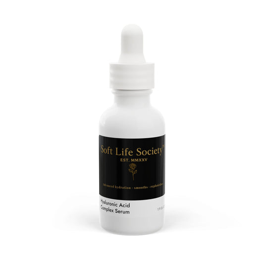White serum bottle with black 'Soft Life Society' label on a white background