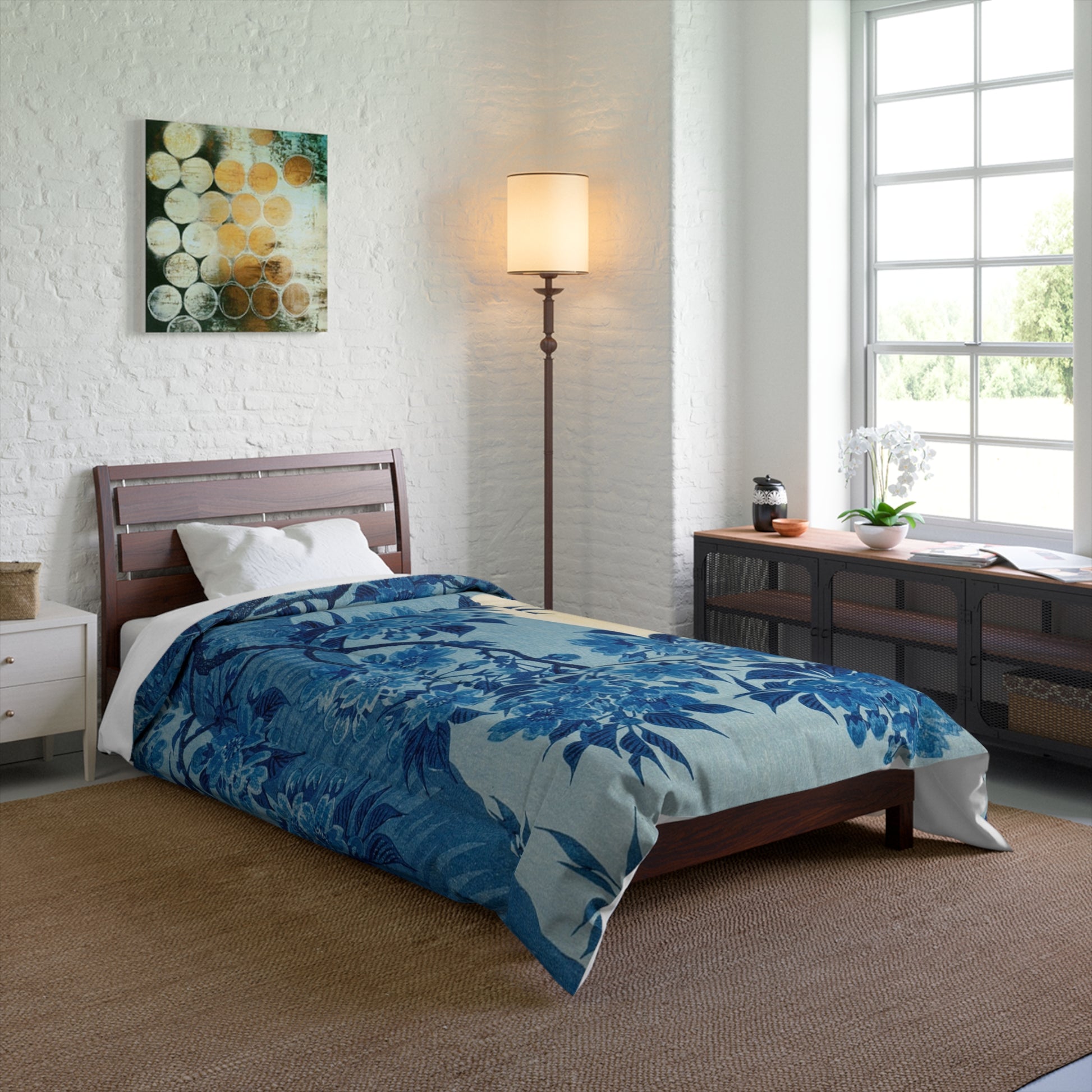Blanket draped over a twin-sized bed for a cozy look in a minimalist room.
