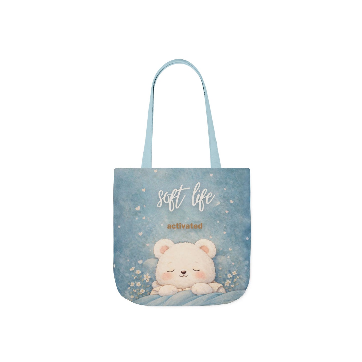 Tote bag with a bear illustration and 'soft life activated' text on a light blue background