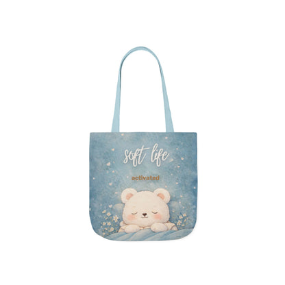 Tote bag with a bear illustration and 'soft life activated' text on a light blue background