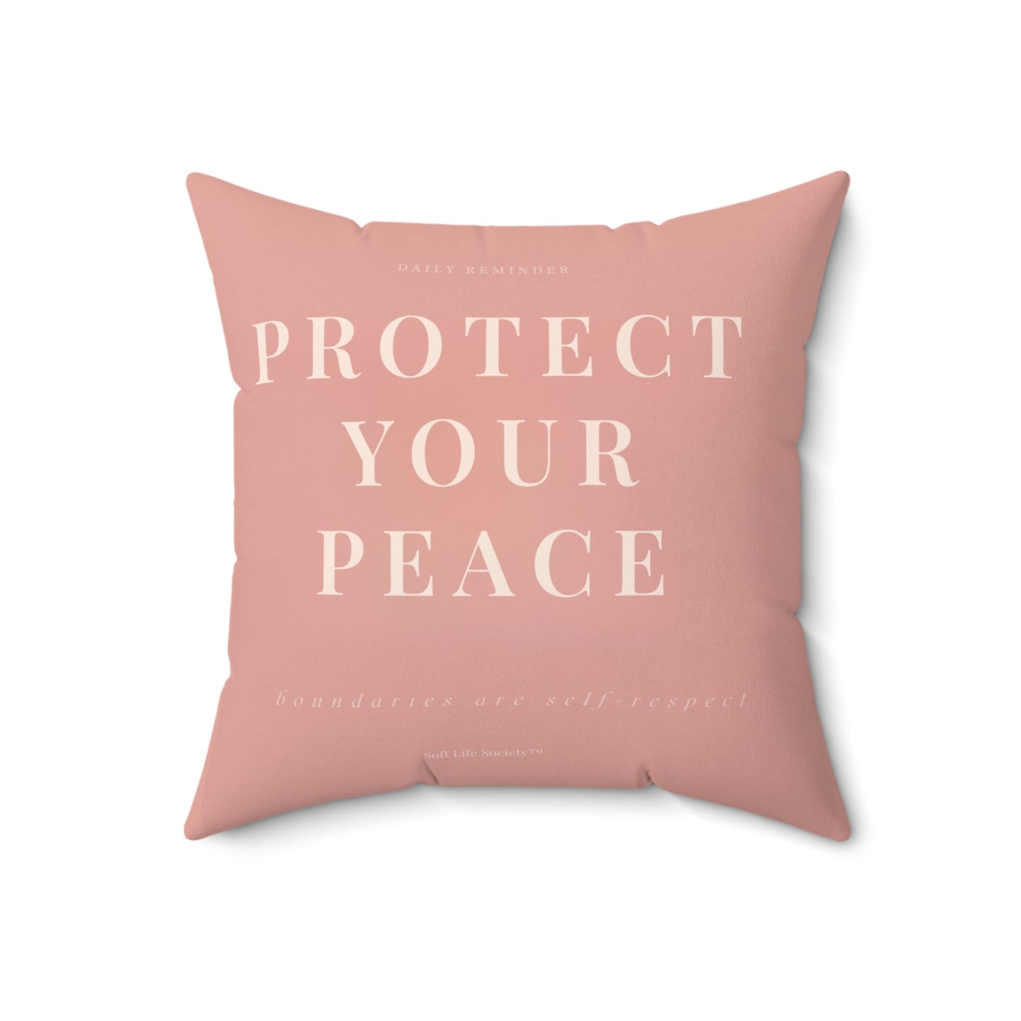 Pink pillow with 'PROTECT YOUR PEACE' text on a white background