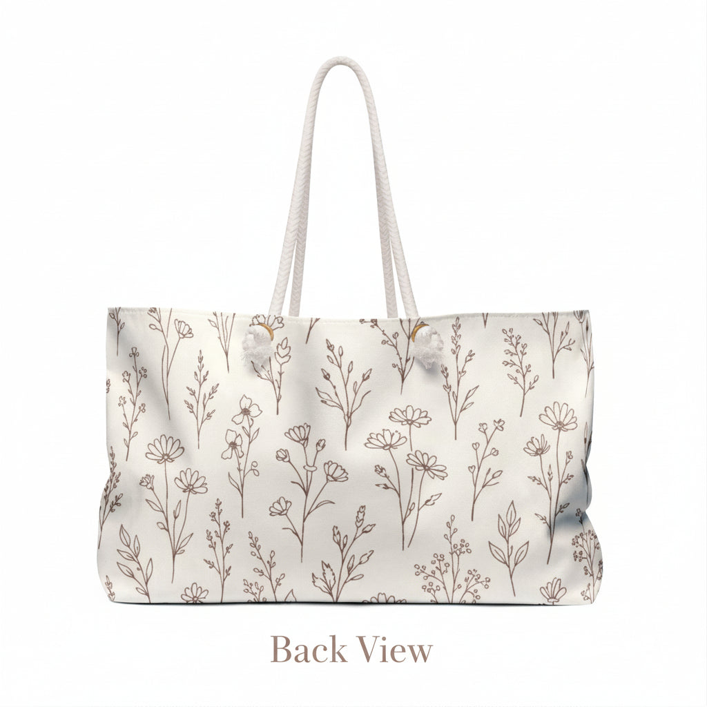 Back view of neutral botanical floral canvas weekender bag with rope handles on clean studio background