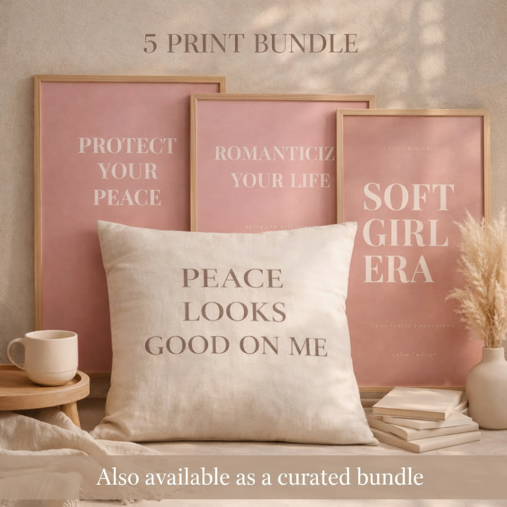 Decorative pillow with text and framed prints on a wall.