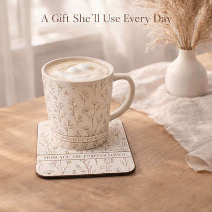 Ceramic mug with floral pattern on a matching floral coaster, filled with a hot beverage, on a wooden surface.
