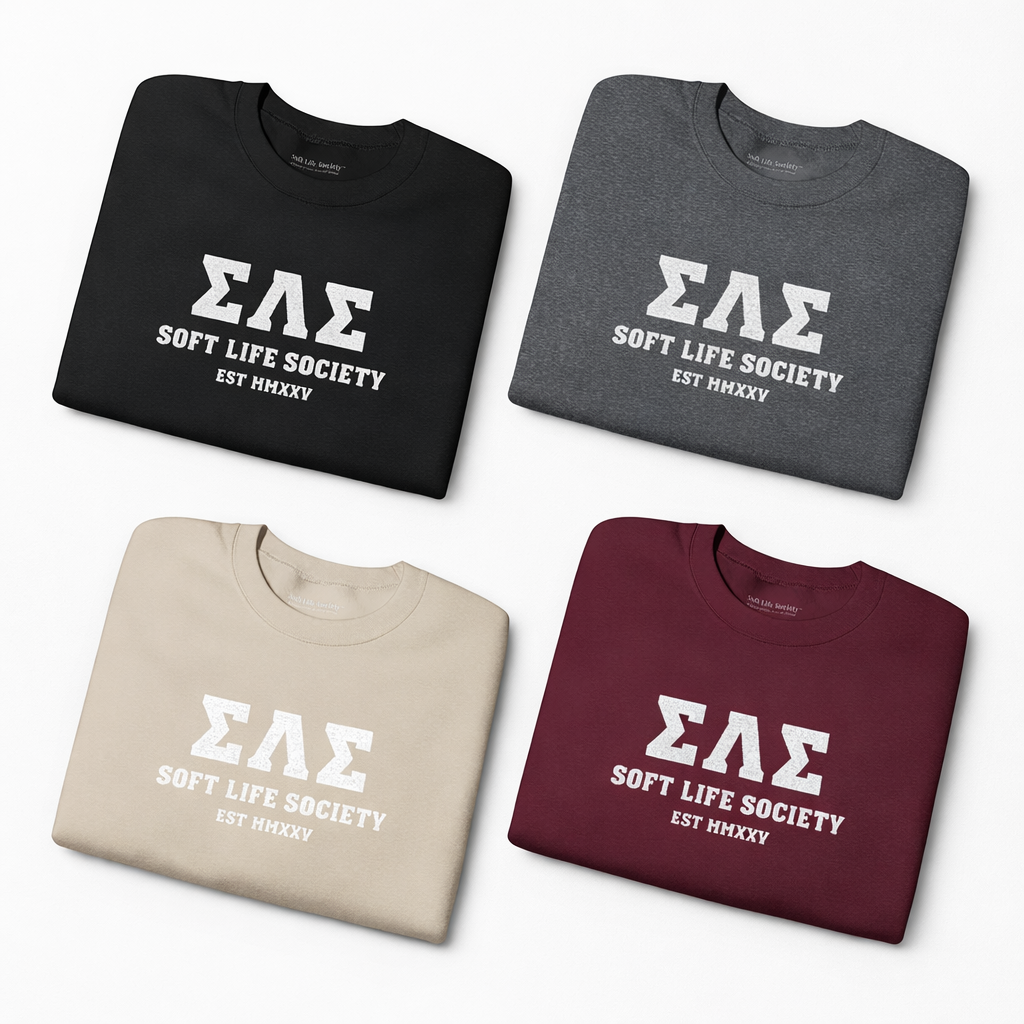 Four folded shirts in black, gray, beige, and maroon with 'ΣΔΣ Soft Life Society EST MMXX' text.